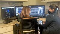 Cardiac imaging fellows review images from scan